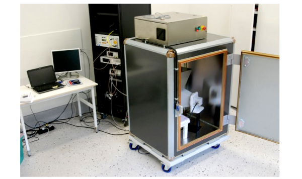 Figure 3. Photograph showing the reverberation chamber (RC) with power amplifier and control equipment. The internal volume of the chamber is 1.24 x 0.98 x 0.82 m3, the working volume is 0.72 x 0.56 x 0.4 m3 and the lowest usable frequency (LUF) is 1 GHz. A 5 kW amplifier will generate field levels up to 20 kV/m in the S-band. A pulse length down to 2 μs is possible while complying with the DO-160 standard without having to load the chamber.