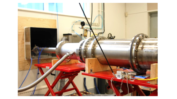 Figure 4. Photograph showing the HPM generator system. The system can produce a power density of the order of 10 MW/m2 over an area of a few square decimetres where the far field of the antenna begins. The vircator is of coaxial type and powered by a 400 J, 400 kV Marx generator. The system can be operated in single shot mode as well as repetitively up to a repetition rate of 10 Hz. The vircator has a cathode with sectioned electron emitter which facilitates the generation of a TE11 mode. Polarization is changed by rotating the cathode so that the direction of electron oscillation is changed.