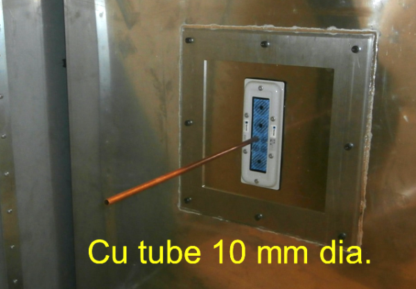 Figure 12. Copper tube with a diameter of 10 mm mounted in the feedthrough which in turn is mounted in the square panel on the inner chamber.